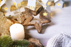 Cosy and soft winter background, knitted sweater and lights